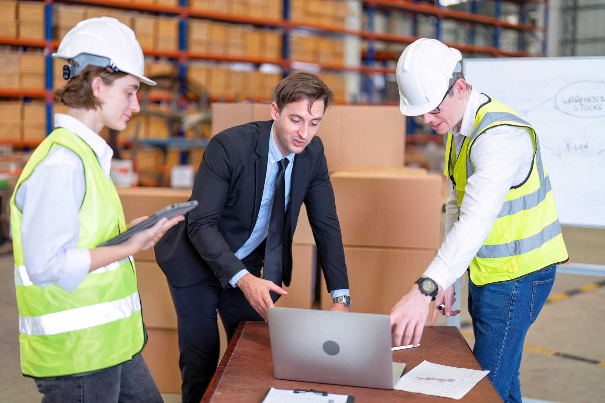 manager visit staff in storage warehouse and have discussion with site team about goods management system he appreciated and congratulation check hand