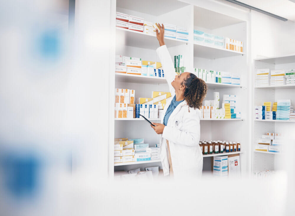 Tablet, pharmacy or woman by shelf with medicine pills or supplements products to check drugs inven.